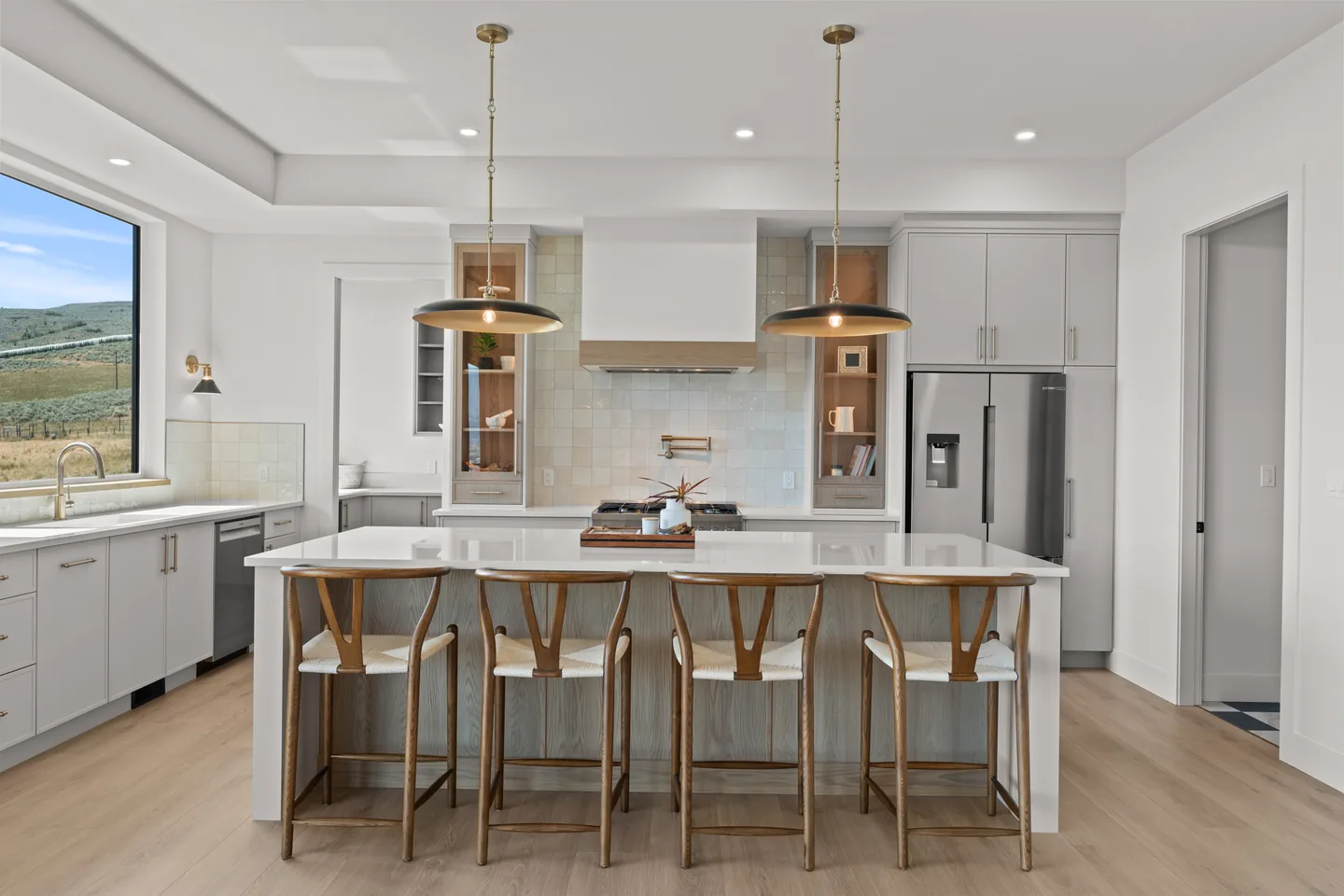 Kitchen with large island and pendant lights